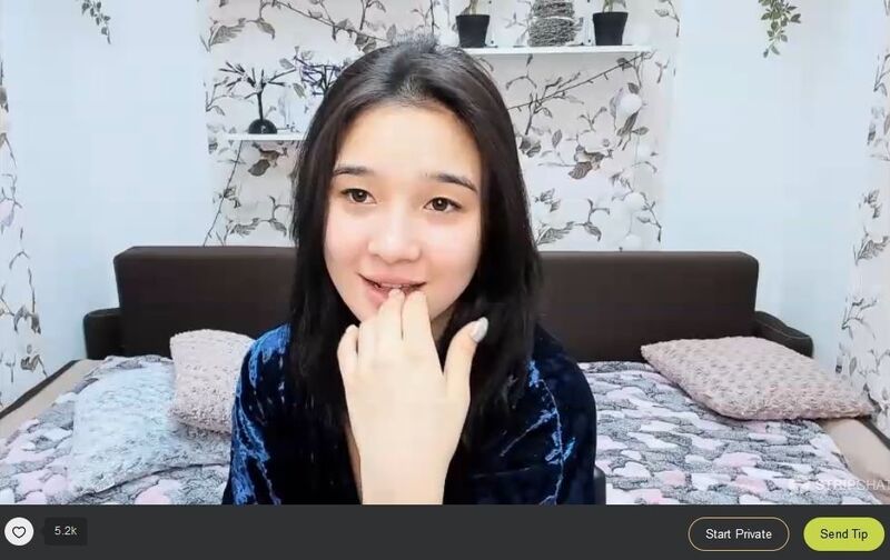 Young Asian cutie flirting with her viewers